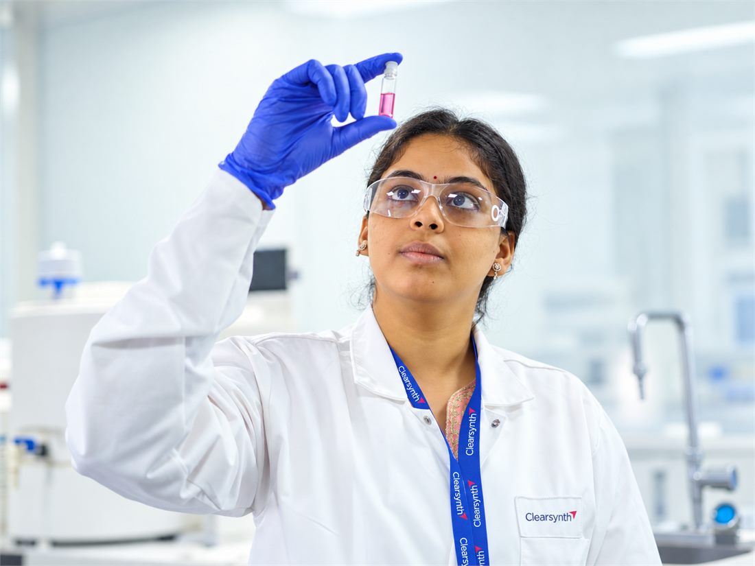 Clearsynth scientist reviewing a labelled material vial